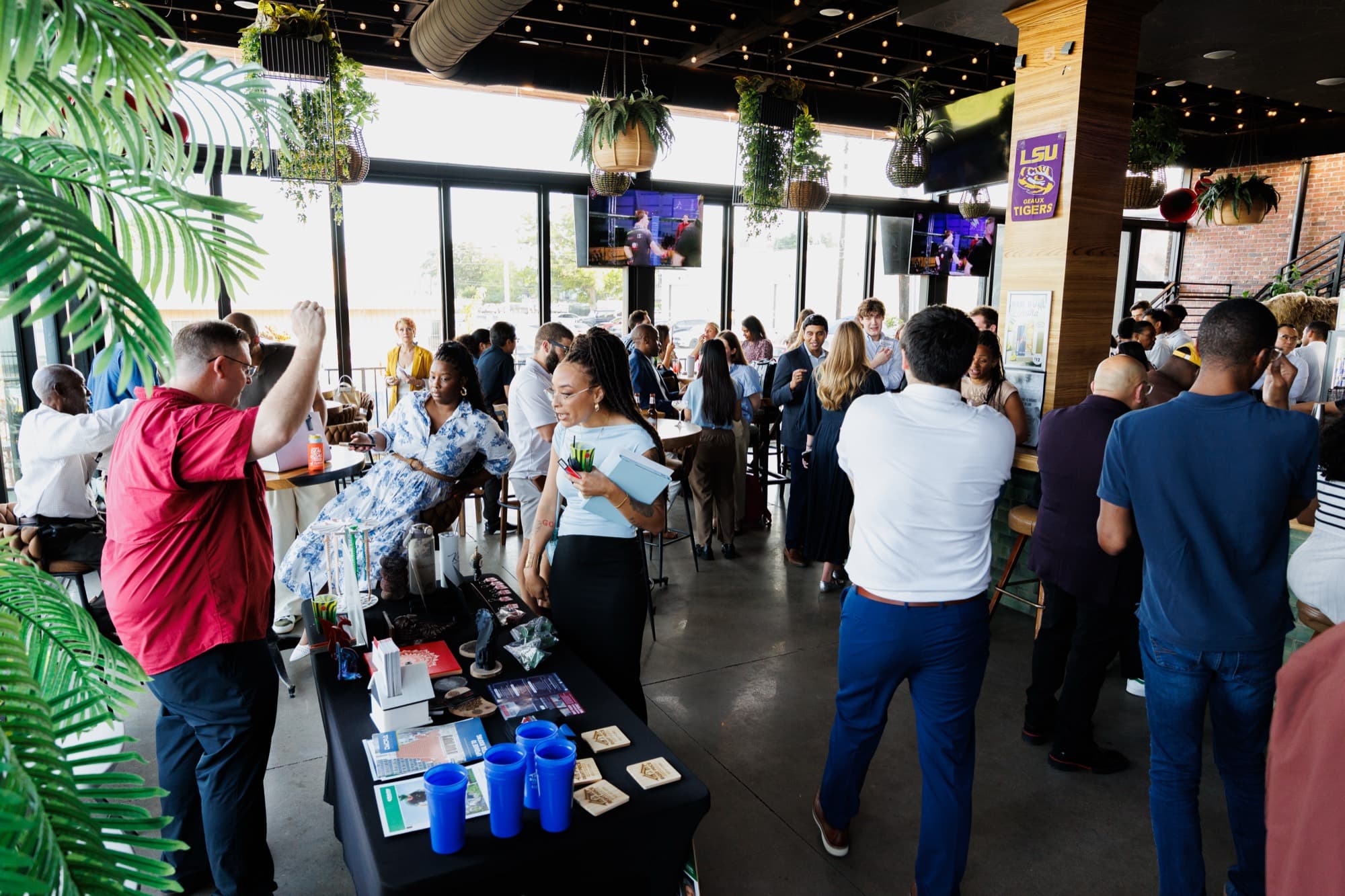 Guests filling the room at a Builders, Brokers & Business social at BLVD Place in Houston.